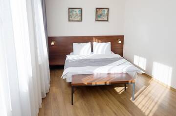 Фото номера Семейный номер с балконом Отель Monte Hotel г. Гудаури 6