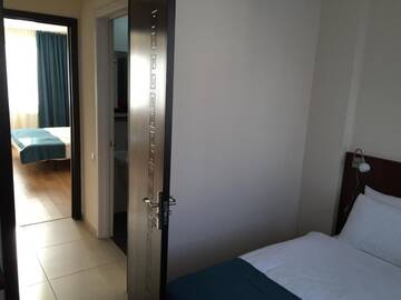 Фото номера Семейный номер с балконом Отель Monte Hotel г. Гудаури 11