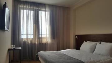 Фото номера Семейный номер с балконом Отель Monte Hotel г. Гудаури 13