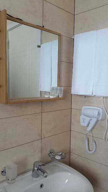 Фото номера Семейный номер с балконом Отель Monte Hotel г. Гудаури 19