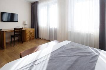 Фото номера Семейный номер с балконом Отель Monte Hotel г. Гудаури 25