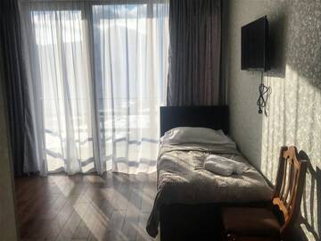 Фото номера Трехместный номер с балконом Гостевой дом Hillsite Gudauri г. Гудаури 6