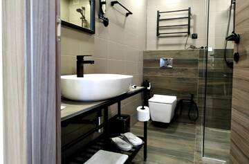 Фото номера Апартаменты с 2 спальнями Отель Gudauri Hills Apart Hotel г. Гудаури 11