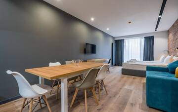 Фото номера Семейный люкс с балконом Апарт-отели Gudauri, Atrium Suites г. Гудаури 10