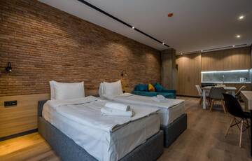 Фото номера Семейный люкс с балконом Апарт-отели Gudauri, Atrium Suites г. Гудаури 8