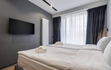 Фото номера Семейный люкс с балконом Апарт-отели Gudauri, Atrium Suites г. Гудаури 11