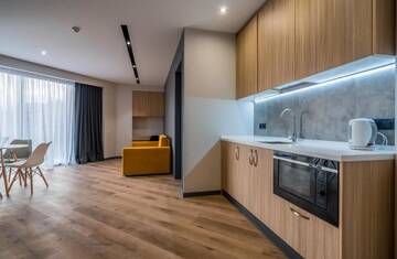 Фото номера Семейный номер с балконом Апарт-отели Gudauri, Atrium Suites г. Гудаури 5