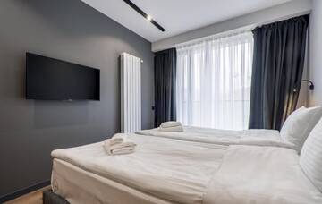 Фото номера Семейный люкс с балконом Апарт-отели Gudauri, Atrium Suites г. Гудаури 5