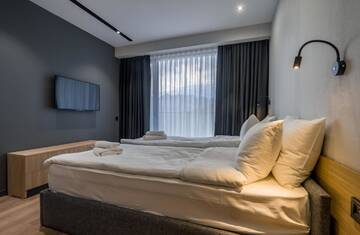 Фото номера Семейный номер с балконом Апарт-отели Gudauri, Atrium Suites г. Гудаури 8