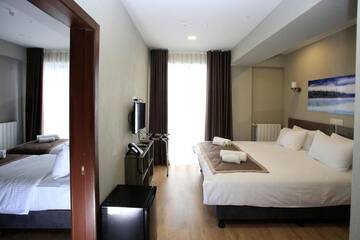 Фото номера Семейный номер с видом на горы Отель GeoGraphy Hotels г. Гудаури 5