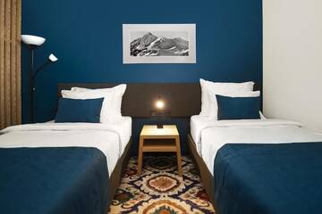 Фото номера Двухместный номер с 2 отдельными кроватями Отель Gudauri Lodge г. Гудаури 3